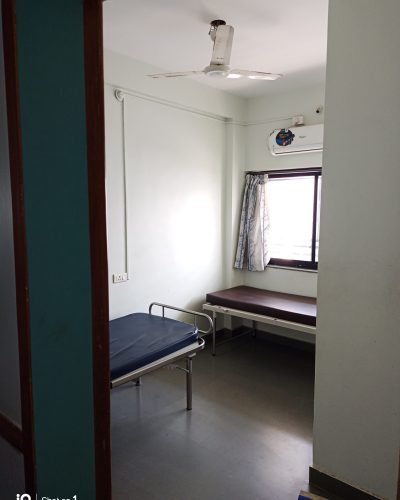 a deluxe room with air conditioning at Yadav Super Speciality Hospital.