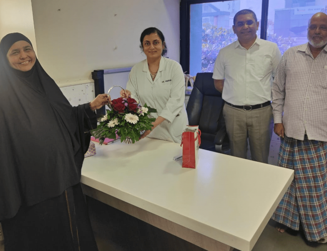 Dr. Anuradha Yadav receiving gratitude from recovered patients