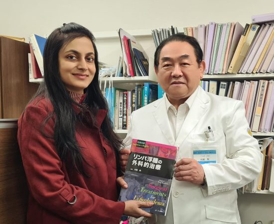 Dr. Anuradha Yadav with Prof. Isao Koshima, holding the book "Surgical Treatments for Lymphedema" in Japan.