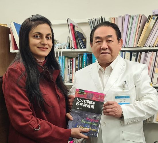 Dr. Anuradha Yadav with Prof. Isao Koshima, holding the book "Surgical Treatments for Lymphedema" in Japan.