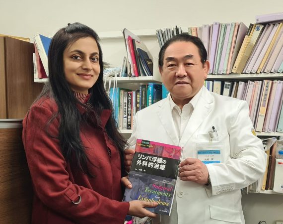 Dr. Anuradha Yadav with Prof. Isao Koshima, holding the book "Surgical Treatments for Lymphedema" in Japan.