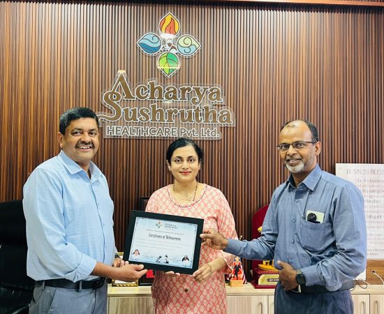 Dr. Anuradha Yadav receiving international training certificate during academic felicitation at Acharya Sushrutha Health Care Pvt Ltd