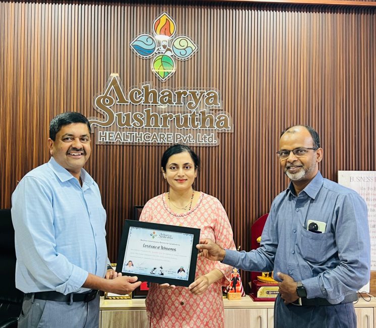 Dr. Anuradha Yadav receiving international training certificate during academic felicitation at Acharya Sushrutha Health Care Pvt Ltd
